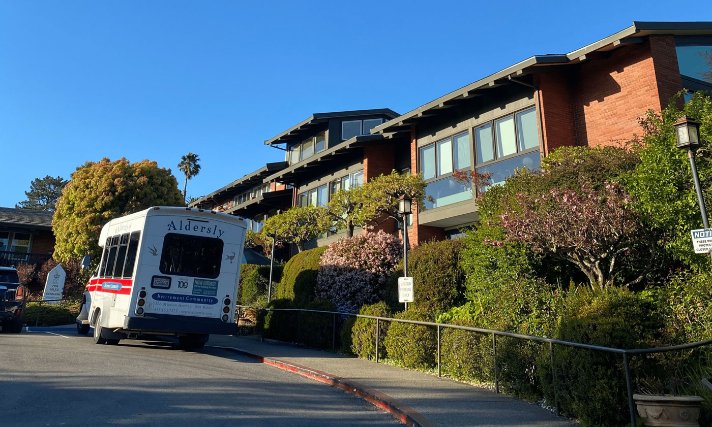 Exterior of Aldersly with transportation van out front