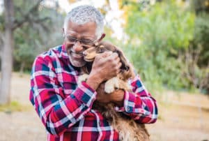 black-man-cuddling-his-puppy