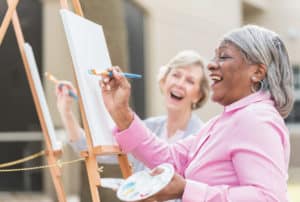 black-woman-laughing-and-painting