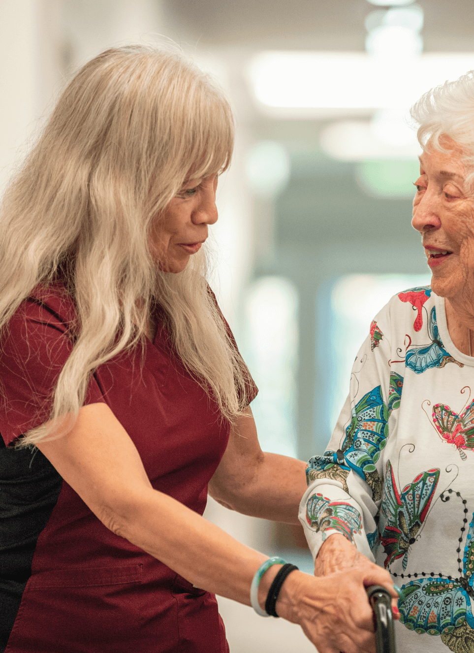Employee helping senior woman