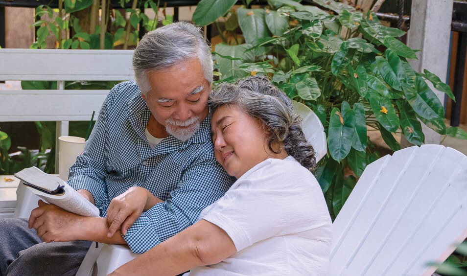 man-reading-to-wife