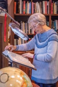 Resident reading in library