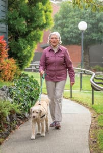 Resident walking her dog
