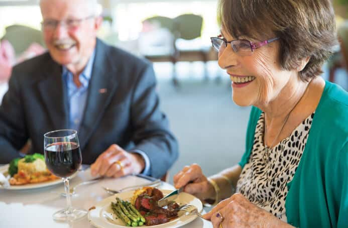senior woman eating her dinner