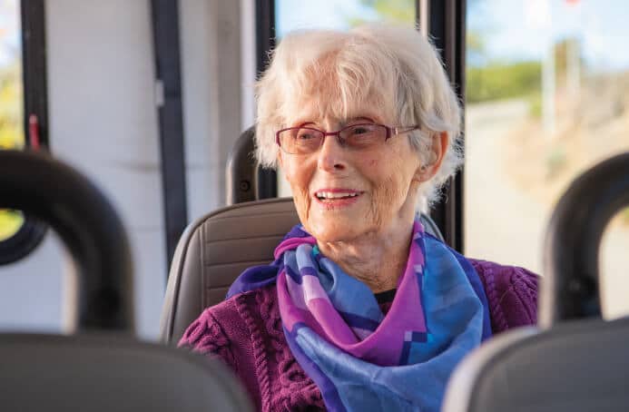 senior woman on bus