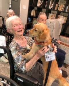 seniors enjoying pet therapy at the Aldersly's memory care facility